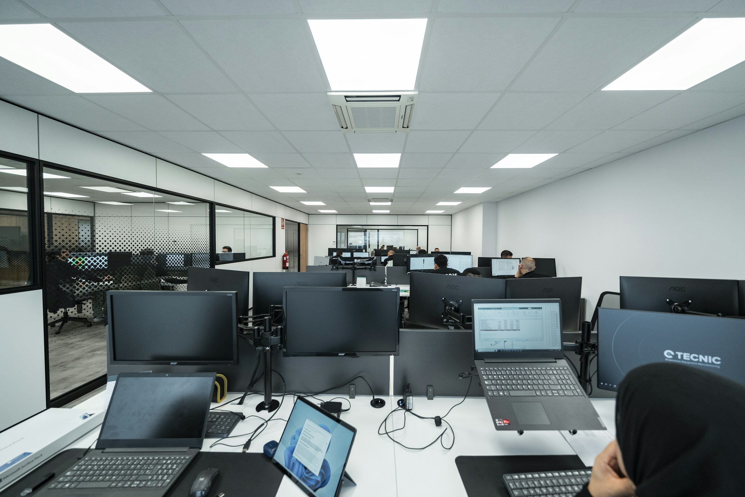 People working at computers in a shared office